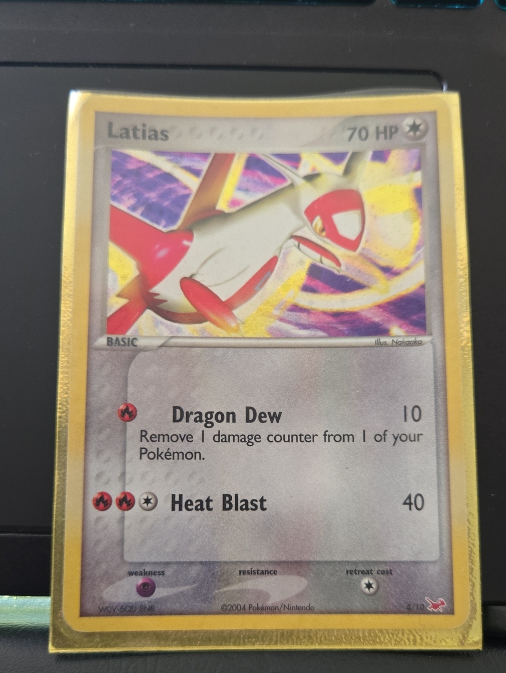 Pokemon Latias Trading Card — Red, White & Gold Accents